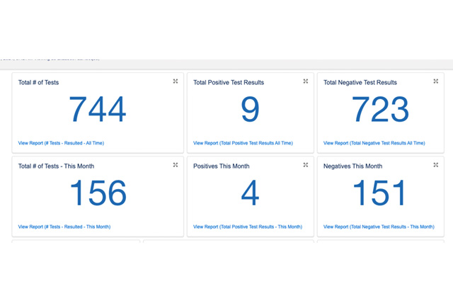 A woman holds a monarch butterfly in her palm