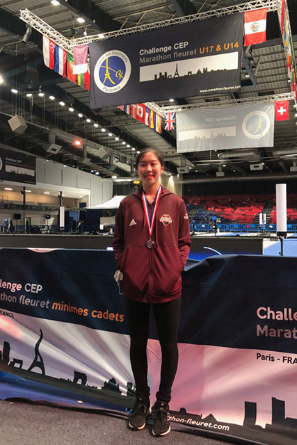 A drawing by a pre-k student of two hearts and a hand